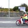 A motorist passed by a poster of Martin Walsh in Ireland.