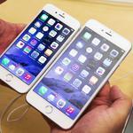 With a 5.5-inch screen, the iPhone 6 Plus (right) is slightly longer and thinner than other iPhone models.