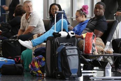 Passengers were seen waiting at O'Hare International Airport in Chicago, Illinois, on Friday.

