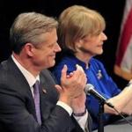 Republican Charlie Baker and Democrat Martha Coakley applauded at the start of a debate in Springfield, Mass. on Monday night. Sept. 29, 2014. 