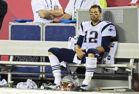 Tom Brady sat on the bench after leaving the game in the fourth quarter.
