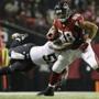 Atlanta Falcons tight end Tony Gonzalez (88) is tackled by New Orleans Saints middle linebacker Curtis Lofton (50) during the second half of an NFL football game, Thursday, Nov. 21, 2013, in Atlanta. (AP Photo/David Goldman)