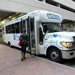 Biotech companies and the town of Lexington split the cost for shuttle buses that carry workers from Alewife Station to biotech research parks.