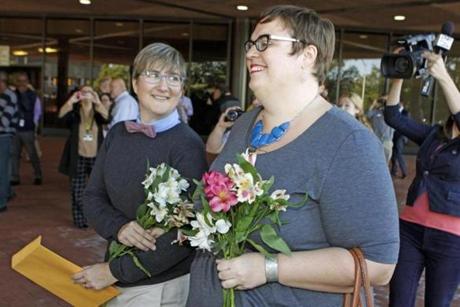 Nicole Pries (left) and Lindsey Oliver reacted after they were the first same-sex couple to be wed in a ceremony outside the John Marshall Court's Building in Richmond.
