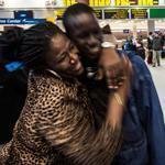 Marie Nellon welcomed her sons Johnson and Thomas upon their arrival from Liberia at JFK Airport Saturday.