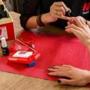 A customer receives Manicube?s signature manicure service, Everyday Mani.