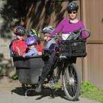 Cambridge mother Katie Starbuck-Bittker rode with all four of her children ? Ivy, 1, Zeke, 4, Dean, 7, and Gray, 9 ? in one bike to a son's baseball game after work.
