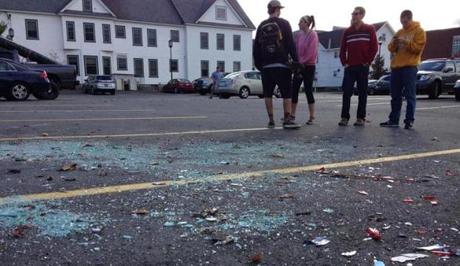 Residents in Keene, N.H., stood near broken glass Sunday morning.
