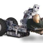 Vecna?s BEAR robot lifts a dummy. A robot like BEAR could help move patients, according to WPI?s Michael Gennert.