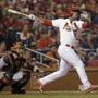 Cardinals rookie Oscar Taveras hit a home run during the seventh inning in Game 2 of the NLCS. (David J. Phillip/Associated Press) 