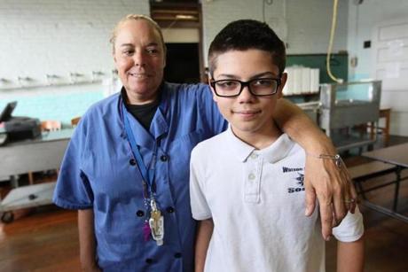 Christine Saurette, who has worked at the Samuel Watson Elementary School in Fall River for five years, dislodged a nacho that was choking Dominick Hernandez.

