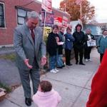 Menino reached out to his grandchild Taylor Menino outside his Hyde Park polling place in 2001.