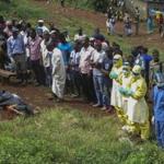 Mourners prayed for an Ebola victim during a funeral Thursday in Freetown, Sierra Leone.
