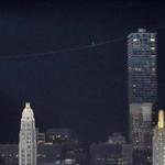 Tightrope walker Nik Wallenda was a dot on the Chicago skyline as he made his way across the Chicago River Sunday.