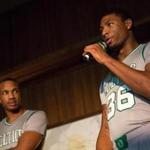 Avery Bradley (left) and Marcus Smart unveil the Celtics? alternative uniforms.