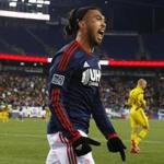Nov 9, 2014; Foxborough, MA, USA; New England Revolution midfielder/forward Lee Nguyen (24) celebrates his goal against the Columbus Crew with forward Charlie Davies during the first half at Gillette Stadium. Mandatory Credit: Winslow Townson-USA TODAY Sports