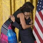 First Lady Michelle Obama hugged Ajani Boyd of Dorchester, a Project STEP student, at the White House. 