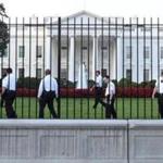 Secret Service officers walked along the fence on the north side of the White House.