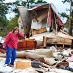 Sue Freeman looked through her destroyed mobile home Monday in Cochran, Ga., after  reports that a tornado had touched down in parts of several Georgia counties.