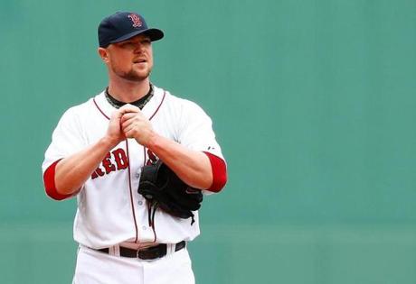 Boston fans deserve to see Jon Lester back in the Red Sox colors Photo by Jared Wickerham/Getty Images
