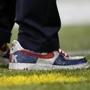 Pats owner Robert Kraft sported sequined Nikes with his customary pinstripes.