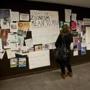 A Wellesley College student read a controversial poster on a bulletin board at the school?s campus center.