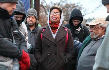 Olivia Petitt of St. Louis cried while praying during a gathering in Clayton, Mo., on Tuesday.

