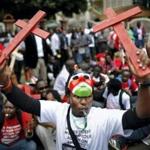 Demonstrators held up painted crosses symbolizing the 28 people who were killed in the attack on a bus in Mandera by Al Shabab. The protesters accused the government of failing to protect the country?s people. 