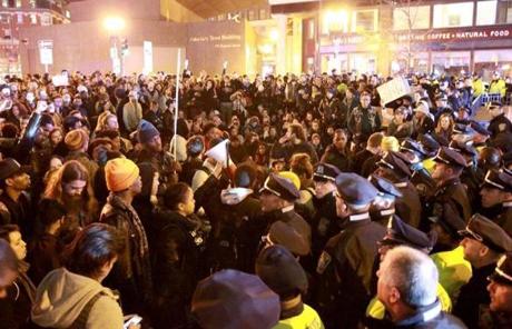 Police and protesters jammed Dewey Square, near an I-93 exit ramp. 
