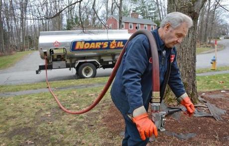 Russ Berg delivered heating oil for Noar?s Oil, of Worcester. Dealers may see an uptick in business as prices moderate.
