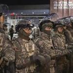 Members of the Missouri National Guard stood guard outside the Ferguson, Mo., police headquarters on Friday.