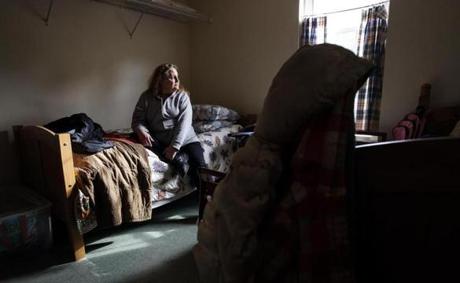 In a Plymouth, N.H., shelter, Lorraine Bar, 57, shares a bedroom with another woman and a child. Her life fell apart after he husband died.
