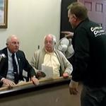 Image from a video shows the scene after Steven G. Cappellini Sr. flipped a table at the health board meeting.