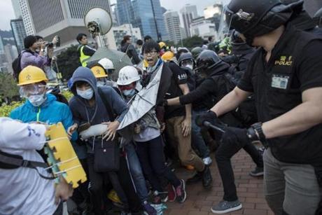 Police used pepper spray and batons as students tried to storm Hong Kong?s government headquarters. 
