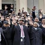 About 200 workers and a few members of Congress stood on the House steps Thursday and silently raised their arms in the ??don?t shoot?? gesture used to protest the death of Michael Brown. 