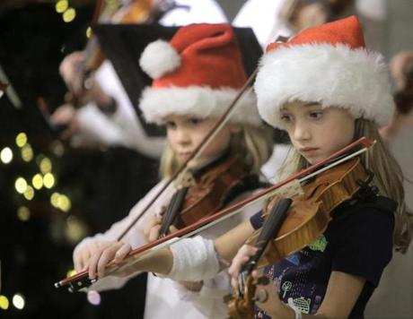 Nine -year-old Sophie Fellows (right) will undergo surgery for a brain tumor on Friday at Dana-Farber in Boston.
Sophie hugged her violin teacher, Carolyn Bever, after the concert at Dana-Farber, where about two dozen students from Vermont played Thursday.
