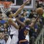 Phoenix Suns forward Anthony Tolliver (40) shoots against Dallas Mavericks forward Brandan Wright (34) during the second half of an NBA basketball game Friday, Dec. 5, 2014, in Dallas. The Suns won 118-106. (AP Photo/LM Otero)