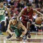 Miami Heat guard Norris Cole recovered a loose ball against Celtics guard Avery Bradley. 