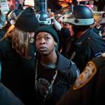 Grand jury decisions in Ferguson and in New York City have inflamed racial tensions across the US. Above, a demonstrator was arrested during a protest last month in NYC.