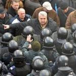  A protester confronted police on Tuesday near Ukraine?s Parliament as lawmakers voted on the measure.  GENYA SAVILOV/AFP/Getty Images