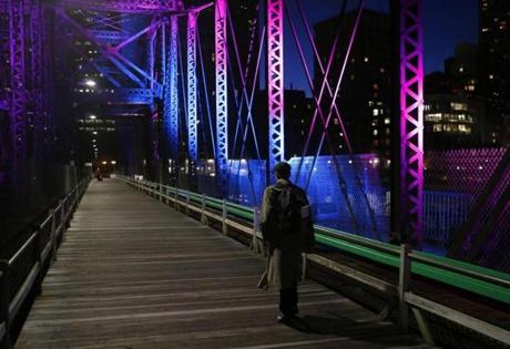 Boston, Massachusetts -- 05/28/2014-- A man walks across the Northern Avenue Bridge in Boston, Massachusetts May 28, 2014. Jessica Rinaldi/Globe Staff Topic: Feature01 Reporter: 
