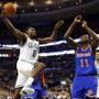 Boston Celtics' Jeff Green goes to the basket against New York Knicks' Samuel Dalembert (11) during the second half of the New York Knicks 101-95 win in an NBA basketball game in Boston Friday, Dec. 12, 2014. (AP Photo/Winslow Townson)