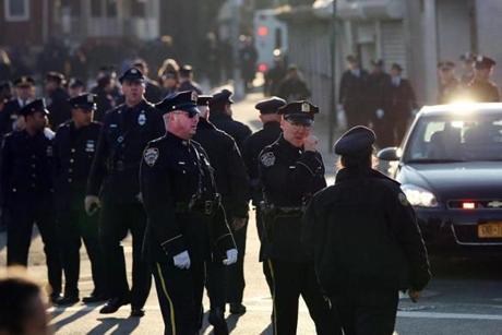 Officers gathered outside of Christ Tabernacle Church for the funeral of slain New York City Police Officer Rafael Ramos. 
