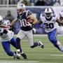New England Patriots wide receiver Danny Amendola (80) runs from Buffalo Bills defenders Larry Dean (54), Corey Graham (20) Marcus Easley (81) as he returns a kick in the second half of an NFL football game Sunday, Dec. 28, 2014, in Foxborough, Mass. (AP Photo/Charles Krupa)