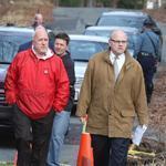 Plymouth District Attorney Timothy Cruz (right, walking with Mayor Bill Carpenter) said the medical examiner is seeking to determine how the two people died.