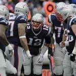 Improved pass protection should help Tom Brady (12) and the offense regain potency in the playoffs. (AP Photo/Charles Krupa)