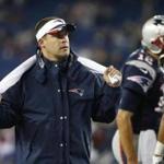 New England Patriots offensive coordinator Josh McDaniels watches as the team warms up before an NFL football game against the New York Jets, Thursday, Oct. 16, 2014, in Foxborough, Mass. (AP Photo/Elise Amendola)