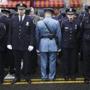 Some officers turned their backs as New York Mayor Bill de Blasio spoke during the funeral for officer Wenjian Liu.