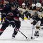 The Hurricanes' Jiri Tlusty (19) and the Bruins' Milan Lucic (17) vie for the puck during the second period.