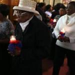 Jesula Dube attended a Requiem Mass held Sunday at St. Angela?s Parish to honor victims of the 2010 earthquake.